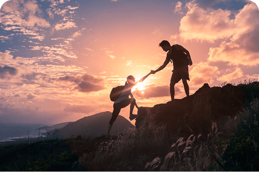 Person helping another on a hike