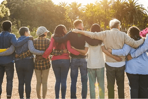 A group with their arms on each others' shoulders