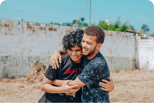 Teammates hugging one another