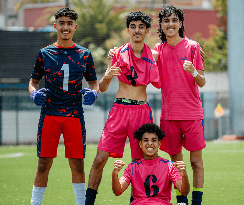 A sports team posing for a photo